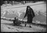 [Untitled photo, possibly related to: Children ride on sleds almost all winter. Woodstock, Vermont]. Sourced from the Library of Congress.