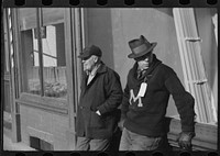Townspeople of Woodstock, Vermont, discussing the severe winter on the street corner in center of town. Sourced from the Library of Congress.