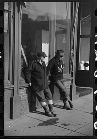 [Untitled photo, possibly related to: Townspeople of Woodstock, Vermont, discussing the severe winter on the street corner in center of town]. Sourced from the Library of Congress.