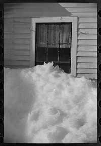 Exceptionally deep snow and sliding snow from roof almost covered the windows of many farmhouses. Woodstock, Vermont. Sourced from the Library of Congress.