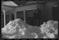 [Untitled photo, possibly related to: Exceptionally deep snow and sliding snow from roof almost covered the windows of many farmhouses. Woodstock, Vermont]. Sourced from the Library of Congress.