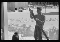 [Untitled photo, possibly related to: Skiers on porch of Mr. Dickinson's home in Lisbon, Franconia, New Hampshire. He installed a ski tow on his property three years ago costing around one thousand dollars, and this is the first year he has made any money on it, but business is increasing rapidly now. He has a small dairy farm and until the hurricane last year destroyed his entire grove of maple trees, he made and sold maple syrup]. Sourced from the Library of Congress.