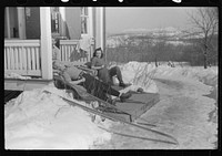 [Untitled photo, possibly related to: Skiers on porch of Mr. Dickinson's home in Lisbon, Franconia, New Hampshire. He installed a ski tow on his property three years ago costing around one thousand dollars, and this is the first year he has made any money on it, but business is increasing rapidly now. He has a small dairy farm and until the hurricane last year destroyed his entire grove of maple trees, he made and sold maple syrup]. Sourced from the Library of Congress.