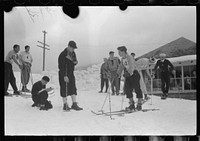 [Untitled photo, possibly related to: Skiers during noon hour outside of toll house at foot of Mount Mansfield, Smugglers Notch. Near Stowe, Vermont]. Sourced from the Library of Congress.