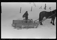 [Untitled photo, possibly related to: Hauling water in milk cans because usual source of supply is frozen on farm near Barre, Vermont]. Sourced from the Library of Congress.