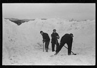 [Untitled photo, possibly related to: Workmen dumping the ice and snow from streets of Berlin, New Hampshire into river]. Sourced from the Library of Congress.