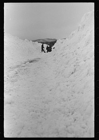 [Untitled photo, possibly related to: Workmen dumping the ice and snow from streets of Berlin, New Hampshire into river]. Sourced from the Library of Congress.