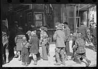 Children waiting to go into movie on Saturday afternoon, Littleton, New Hampshire by Marion Post Wolcott