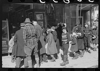 Children and farmers waiting to go into movie on Saturday afternoon, Littleton, New Hampshire. Sourced from the Library of Congress.