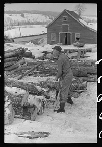 Hired man hauling logs on farm near Waterbury, Vermont. They are then sold to the mill. He said "There ain't nothin' meaner than a log except a woman when she wants to be. They sure can be stubborn.". Sourced from the Library of Congress.