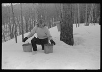 [Untitled photo, possibly related to: Young neighbor of Frank H. Shurtleff resting in the snow while gathering sap from sugar trees for making maple syrup. Sugaring is a social event and is enjoyed by all young people and children in the neighborhood. The Shurtleff farm has about 400 acres and was originally purchased by grandfather in 1840. He raises sheep, cows, cuts lumber, and has been making maple syrup for about thirty-fiv years. Sugaring brings in about one thousand dollars annually. Because of the deep snow this year he only tapped 1000 of his 2000 trees. He expects to make about 300 to 500 gallons this year. North Bridgewater, Vermont]. Sourced from the Library of Congress.
