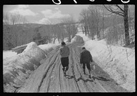 Two farmer's children going home after visiting a neighbor during spring thaw near Woodstock, Vermont. Sourced from the Library of Congress.
