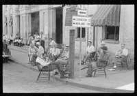 [Untitled photo, possibly related to: Farmers exchanging news and greetings on Saturday afternoon in front of courthouse. Versailles, Kentucky]. Sourced from the Library of Congress.
