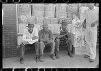 [Untitled photo, possibly related to: Farmers in front of store on Saturday afternoon in Cave City [actually Horse Cave], Kentucky]. Sourced from the Library of Congress.