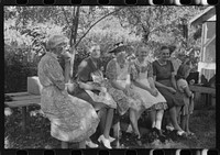[Untitled photo, possibly related to: Parishoners of St. Thomas Church resting after spending many hous preparing food for a benefit picnic supper. Near Bardstown, Kentucky]. Sourced from the Library of Congress.