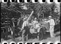 [Untitled photo, possibly related to: Unpacking supplies at the St. Thomas Church picnic supper near Bardstown, Kentucky]. Sourced from the Library of Congress.