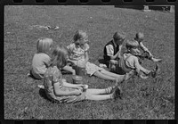 [Untitled photo, possibly related to: Child eating lunch during the noon hour at school in Breathitt County, Kentucky. In his lunch pail were cold potatoes, corn bread and mush]. Sourced from the Library of Congress.
