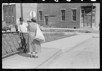 Stopping to exchange greetings and news on the way to town to peddle and trade vegetables for other commodities. Jackson, Breathitt County, Kentucky. Sourced from the Library of Congress.