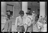 [Untitled photo, possibly related to: Farmers and townspeople in front of courthouse on court day, in Campton, Kentucky]. Sourced from the Library of Congress.