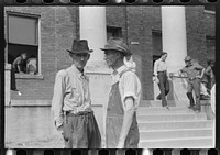 [Untitled photo, possibly related to: Farmers and townspeople in front of courthouse on court day, in Campton, Kentucky]. Sourced from the Library of Congress.