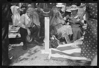 [Untitled photo, possibly related to: Mother and relatives weeping at the grave of the deceased at memorial meeting near Jackson, Kentucky, Breathitt County. See general caption no. 1]. Sourced from the Library of Congress.