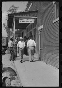 [Untitled photo, possibly related to: Farmers and townspeole on "Jockey Street" in Campton, Kentucky]. Sourced from the Library of Congress.
