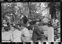 [Untitled photo, possibly related to: Preacher, relatives and friends of the deceased at a memorial meeting near Jacson, Breathitt County, Kentucky. See general caption no. 1]. Sourced from the Library of Congress.