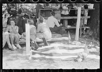 [Untitled photo, possibly related to: Grave decorated for a memorial meeting held annually for the deceased of each family, particularly in the summer and early fall when relatives can come from other communitites and states. Near Jackson, Breathitt County, Kentucky. See general caption no. 1]. Sourced from the Library of Congress.