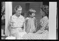 [Untitled photo, possibly related to: Mountain woman on porch near Burton's Fork, Kentucky River, near Jackson, Kentucky]. Sourced from the Library of Congress.