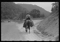 [Untitled photo, possibly related to: Rural postman who delivers mail to the mountain families up the side roads and creek beds. Near Jackson, Kentucky]. Sourced from the Library of Congress.