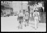 [Untitled photo, possibly related to: Farmers hanging in front of stores on Saturday, Jackson, Kentucky]. Sourced from the Library of Congress.