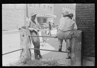 Farmers hang around in front of courthouse, on Saturday, Jackson, Kentucky. Sourced from the Library of Congress.