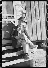 [Untitled photo, possibly related to: Noah Garland sitting on the steps of his son's home, Southern Appalachian Project, near Barbourville, Knox County, Kentucky]. Sourced from the Library of Congress.
