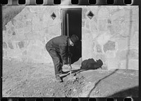 Mr. S. Castle or Mr. William S. Allen working in front of new storage house he built on their farm with FSA (Farm Security Administration) help. Southern Appalachian project, near Barbourville, Knox County, Kentucky. Mr. William S. Allen cleaning up yard in front of his new storage house, Southern Appalachian Project, near Barbourville, Knox County, Kentucky. Sourced from the Library of Congress.