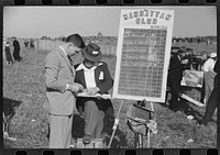 Bookies taking bets at horse races, Warrenton, Virginia. Sourced from the Library of Congress.