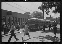 [Untitled photo, possibly related to: Workers leaving plant at afternoon change of shift, Pratt and Whitney, United Aircraft, East Hartford, Connecticut]. Sourced from the Library of Congress.