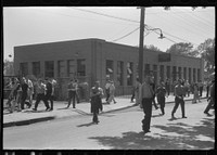 [Untitled photo, possibly related to: Workers leaving plant at afternoon change of shift, Pratt and Whitney, United Aircraft, East Hartford, Connecticut]. Sourced from the Library of Congress.