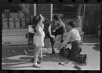 Children shining shoes on street corner, Hartford, Connecticut. Sourced from the Library of Congress.