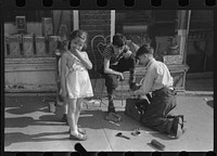 [Untitled photo, possibly related to: Children shining shoes on street corner, Hartford, Connecticut]. Sourced from the Library of Congress.