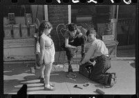 Children shining shoes on street corner, Hartford, Connecticut. Sourced from the Library of Congress.