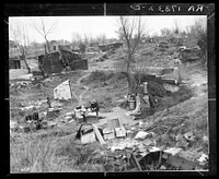 Migrant workers' camp, outskirts of Marysville, California. The new migratory camps now being built by the Resettlement Administration will remove people from unsatisfactory living conditions such as these and substitute at least the minimum of comfort and sanitation. Sourced from the Library of Congress.