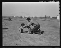 Drought refugees. Penniless Oklahomans camped along highway. Came seven months ago. "Can't make it. Want to go back. Ate up our car. Ate up our tent. Living like hogs." California by Dorothea Lange