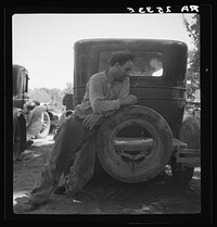 Migrant agricultural worker in Marysville migrant camp (trying to figure out his year's earnings). California. Sourced from the Library of Congress.