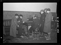 A game of checkers in a pool hall in Spencer, Iowa. Saturday afternoons and evenings are the crowded times by Russell Lee