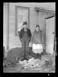 Edgar Allen and his wife at the rear of house on farm near Milford, Iowa by Russell Lee
