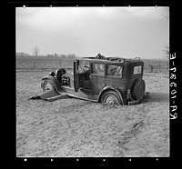 Automobile after the flood on Mackey Ferry Road near Mount Vernon, Indiana by Russell Lee