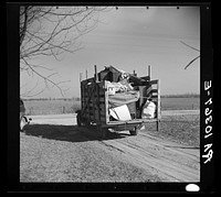 A truckload of household goods being moved off the farm of Everett Shoemaker, tenant farmer. Near Shadeland, Indiana by Russell Lee