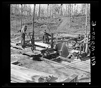 Cutting timber into boards at the country sawmill near Omaha, Illinois by Russell Lee