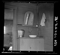 Washing facilities in the home of Elmer Johnson, hired farmhand. Near Battle Ground, Indiana. His employer has a bathroom in a modern house by Russell Lee