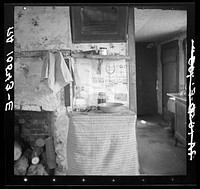 Washroom in the living room in the home of Erasty Emrich, tenant farmer. Near Battle Ground, Indiana by Russell Lee